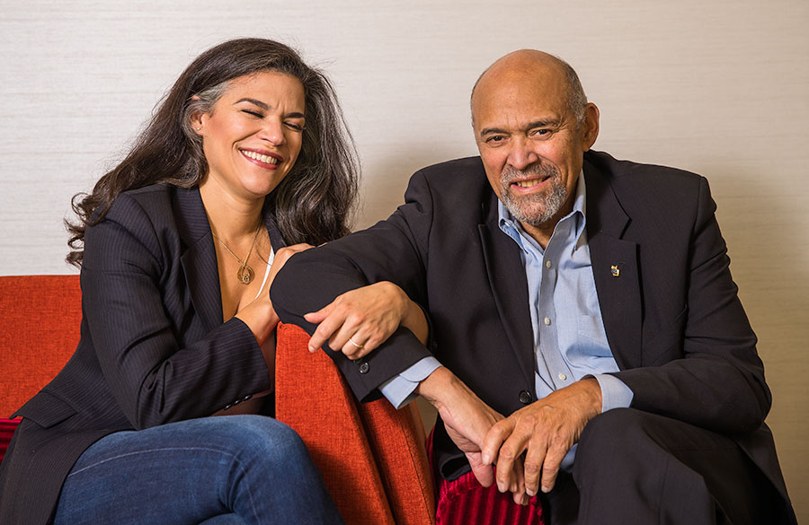 A portrait of Sarah Bellamy sitting next to her dad Lou Bellamy.