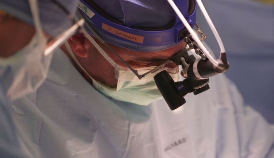 Doctor wearing surgical loupes performing a congenital heart surgery at Mayo Clinic