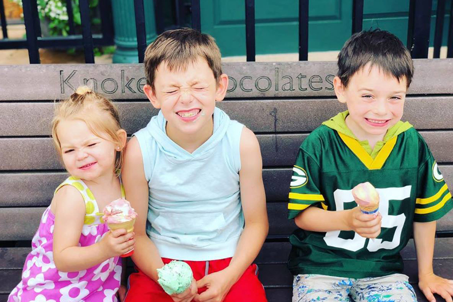 Three kids eating Knoke's ice cream in Hudson, Wisconsin