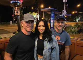 Jeff Graba and his twin brother, Jess Graba, with Suni Lee