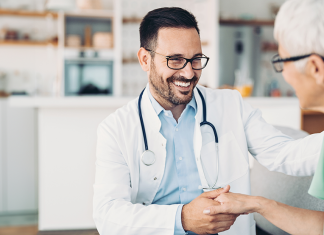 How To Choose the Right Urgent Care for an Injury or Illness doctor holding patients hand