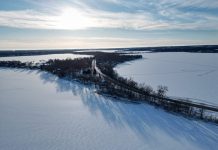 aerial shot of iced over lake